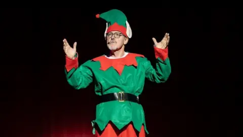 Joe Higham's REPORTAGE Griff Rhys Jones dressed as an elf