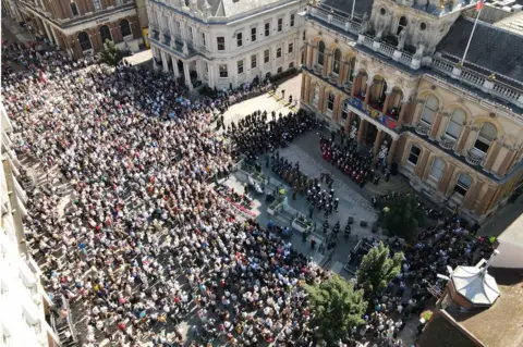 Suffolk County Council People listening to the proclamation on Ipswich's Cornhill