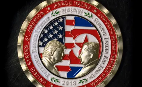 AFP/Getty Trump-Kim coin
