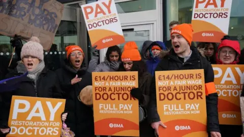 PA Media Striking NHS junior doctors on the picket line outside Queen Elizabeth hospital in Birmingham