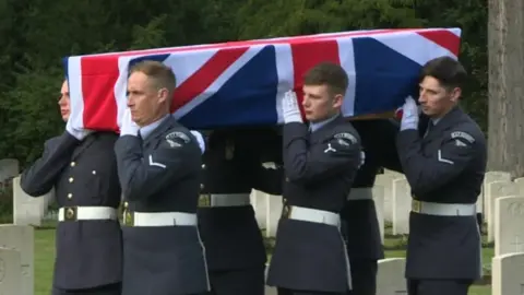 Broadcasting Flevoland RAF serviceman carry a coffin draped in a union flag