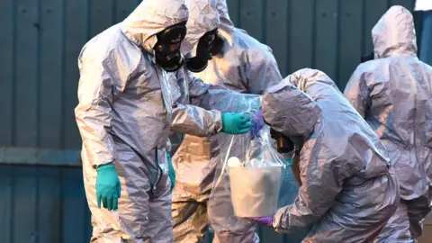 Getty Images people in hazmat suits and masks at salisbury poisoning scene