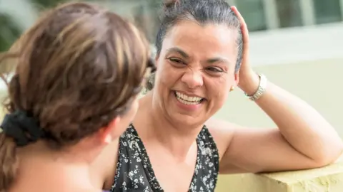 Getty Images Neighbours chatting