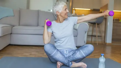 Getty Images woman doing weights