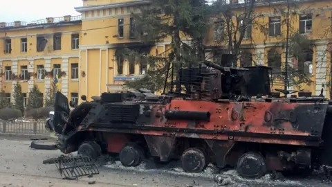 Reuters A destroyed Ukrainian vehicle in Kharkiv