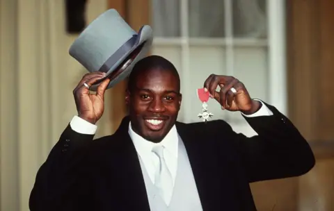 Photoshot Martin Offiah after receiving his MBE