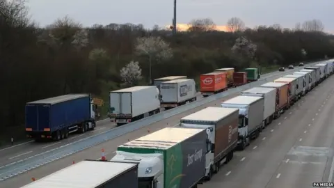 PA Media Lorries queue on the A20 outside Dover in Kent where Operation Stack is being implemented