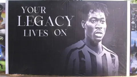 BBC A poster of Christian Atsu with the words 'Your legacy lives on'