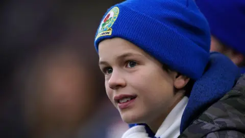 PA Media Young Blackburn Rovers fan