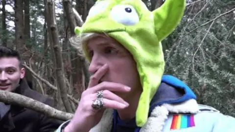 AFP Screengrab from the video posted by Logan Paul in Japan's Aokigahara forest