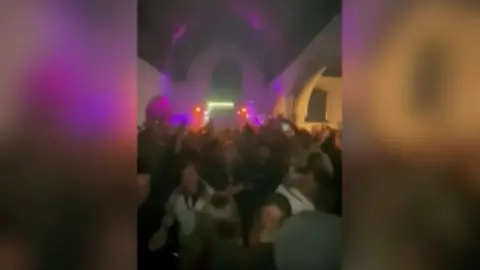 Footage of people at illegal rave