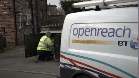 Getty Images An Openreach worker next to a company van