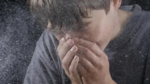Science Photo Library Boy sneezing