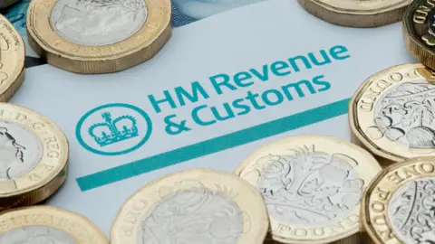 Alamy HM Revenue and Customs logo surrounded by coins