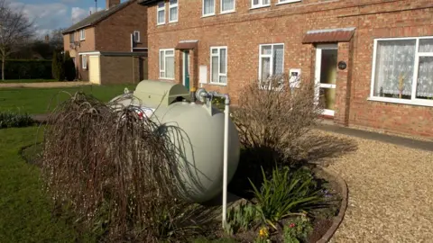 Getty Images Oil tank in garden