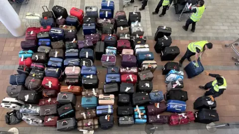 Shutterstock Luggage at Heathrow Airport