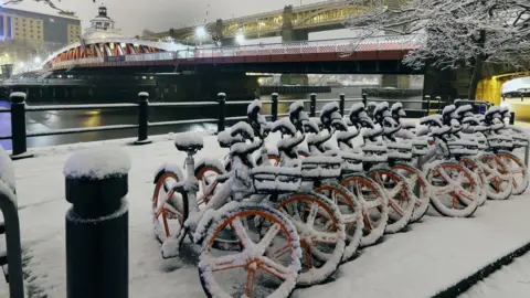 PA The quayside in Newcastle covered in snow