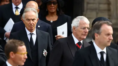 WPA Pool British former prime ministers Tony Blair and John Major leave Westminster Abbey after the service