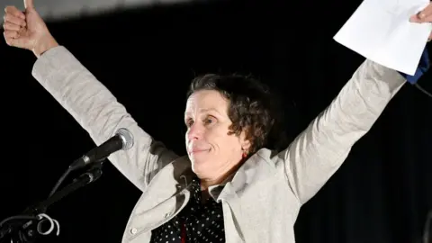 Getty Images Frances McDormand spoke on stage at the Drive-In Premiere of Nomadland in California this month