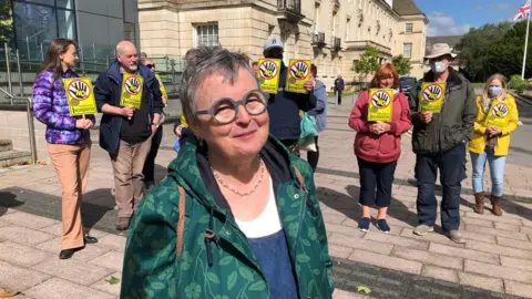 Protesters gathered outside the County Hall.