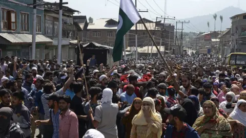 AFP Mourners carry the body of the dead youth - 2 June