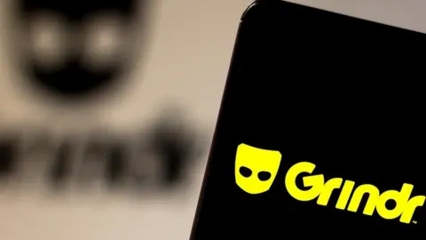 SOPA Images Grindr on phone