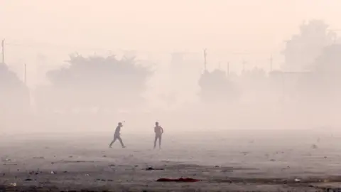 Ankit Srinivas Children playing cricket in smog