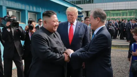 EPA Kim Jong-un, Donald Trump and Moon Jae-in at the DMZ (30 June 2019)