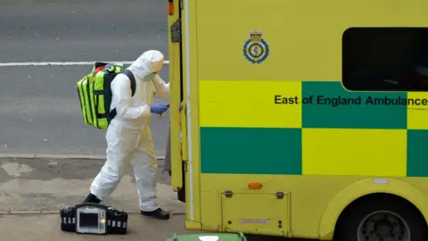 REUTERS/Mark Hartnell Stock image of paramedic in PPE