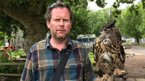 BBC Welsh Hawking Centre boss Jamie Munro with Buzz the European Eagle Owl