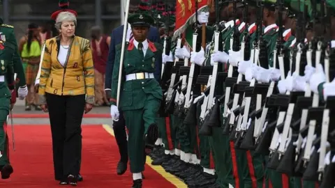 PA Theresa May arriving in the Nigerian capital of Abuja