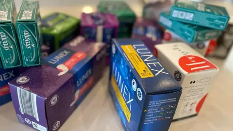 Some of the packages of sanitary products collected and distributed by Love Your Period