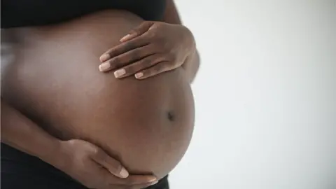Getty Images Stock photo of a pregnant woman's belly