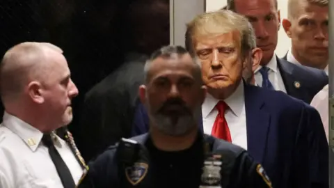 EPA-EFE/REX Donald Trump entering the courtroom