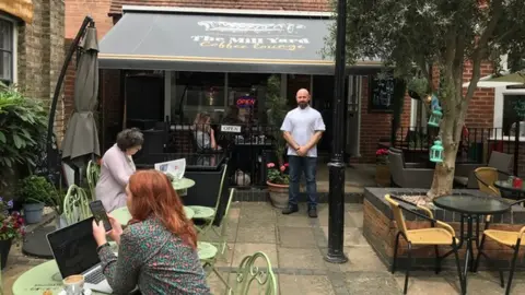 Frank Fiore outside his cafe