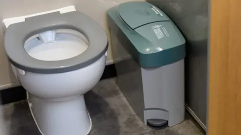 Phs group urinary incontinence bin in toilet stall