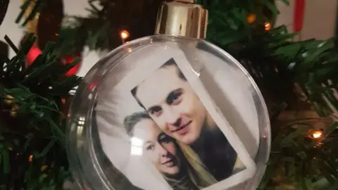 Jo Bullwinkel A bauble with a couple's photo inside