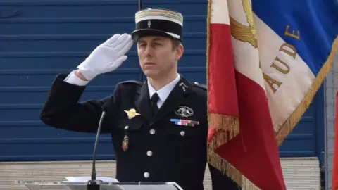 AFP / GENDARMERIE NATIONALE Lt-Col Arnaud Beltrame pictured at the Carcassone military headquarters earlier in 2018