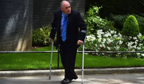 Getty Images Conservative member of parliament Robert Halfon arrives for a meeting at 10 Downing Street in central London on May 11, 2015