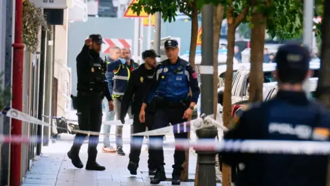 Borja Sánchez-Trillo/EPA-EFE/REX/Shutterstock Police members inspect the area after former president of the People's Party of Catalonia and Former Vice-President of the European Parliament, Alejo Vidal-Quadras, was shot in the face