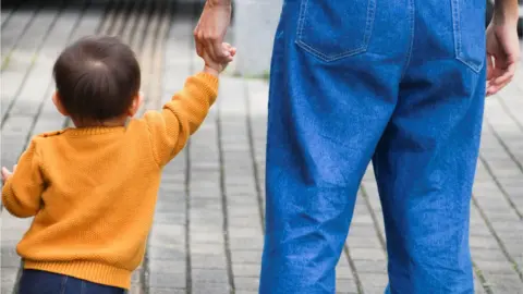 Getty Images Man and boy, Uruma City, Okinawa