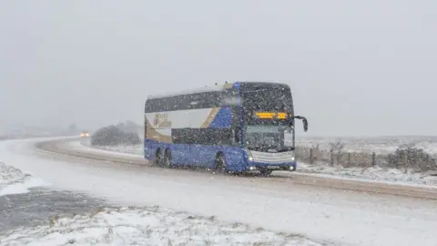Aerial Vision A bus travels across the Glenshane Pass