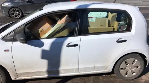 South Yorkshire Police Car overloaded with parcels