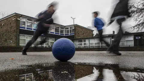 PA Media Children playing