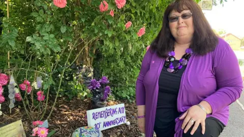 Jane Hofmeister at the shrine for Amy on Blackbrook Way