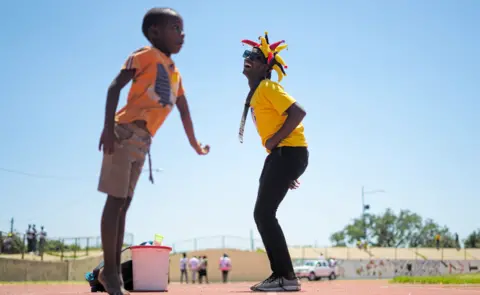 AFP Citizens Coalition for Change supporters dancing during a political rally at White City Stadium in Bulawayo, Zimbabwe - Saturday 5 March 2022