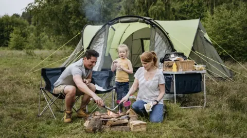 Getty Images A family at a camp site