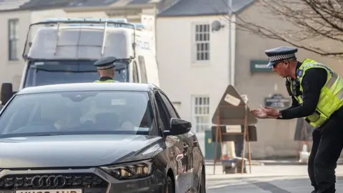 Danny Lawson/PA Wire Police at checkpoint in York