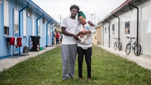 Marco Panzetti Rigat Kebede, 18, and her new-born son Bitab, along with the boy's 22-year-old father, Stezgi Wamn