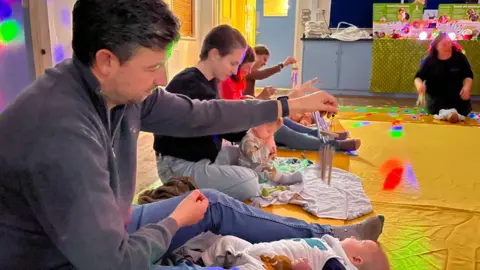 Martin Giles/BBC Baby Sensory class in St Peter's Church Hall, Cringleford